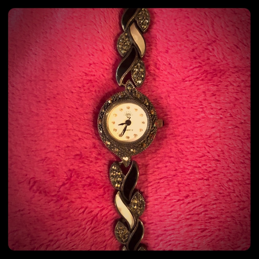 Black, rhinestone, and pearl plated Quartz watch